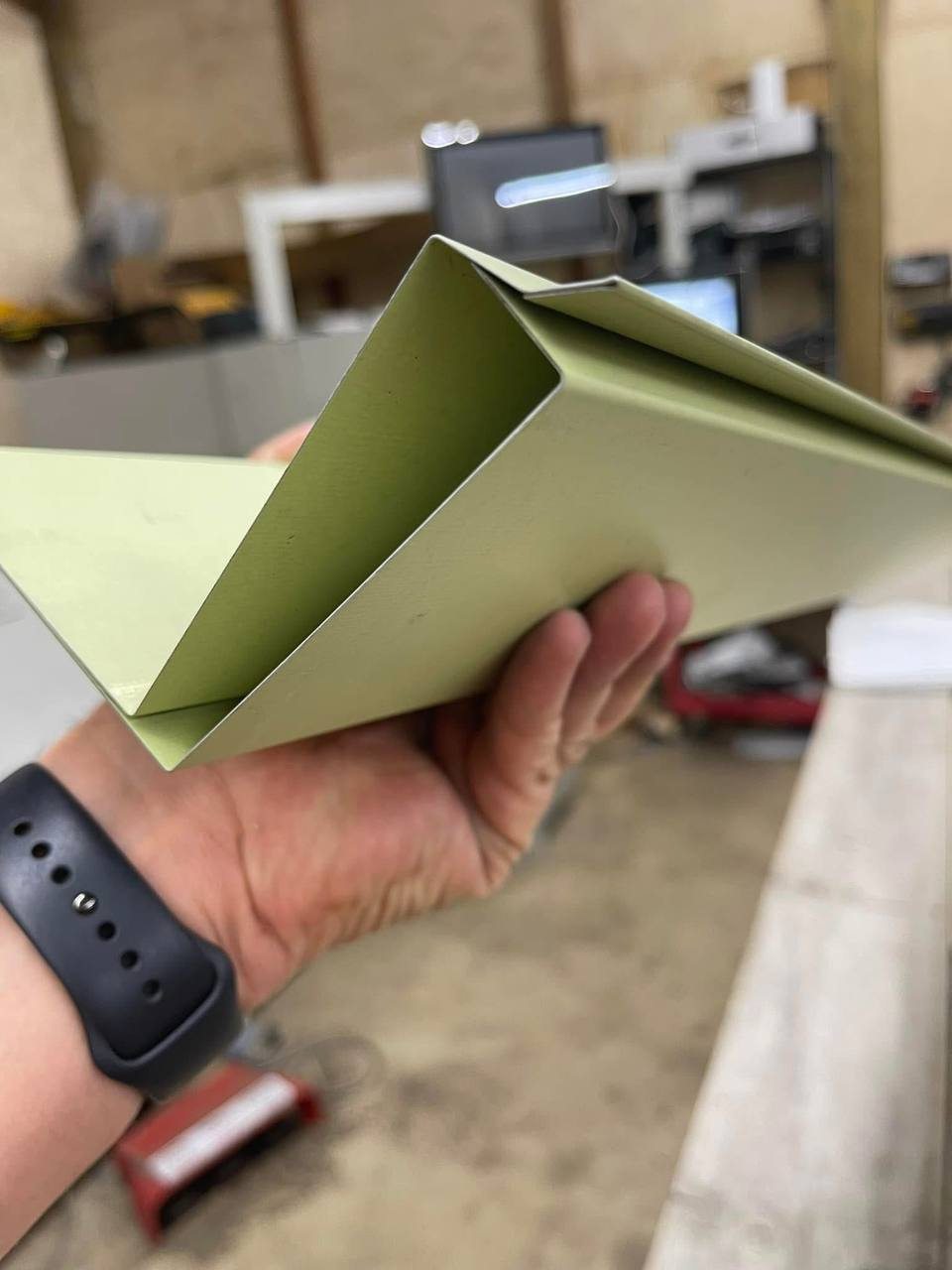 Cross-section of a coping system: outer cap, continuous undercap and concealed cleat