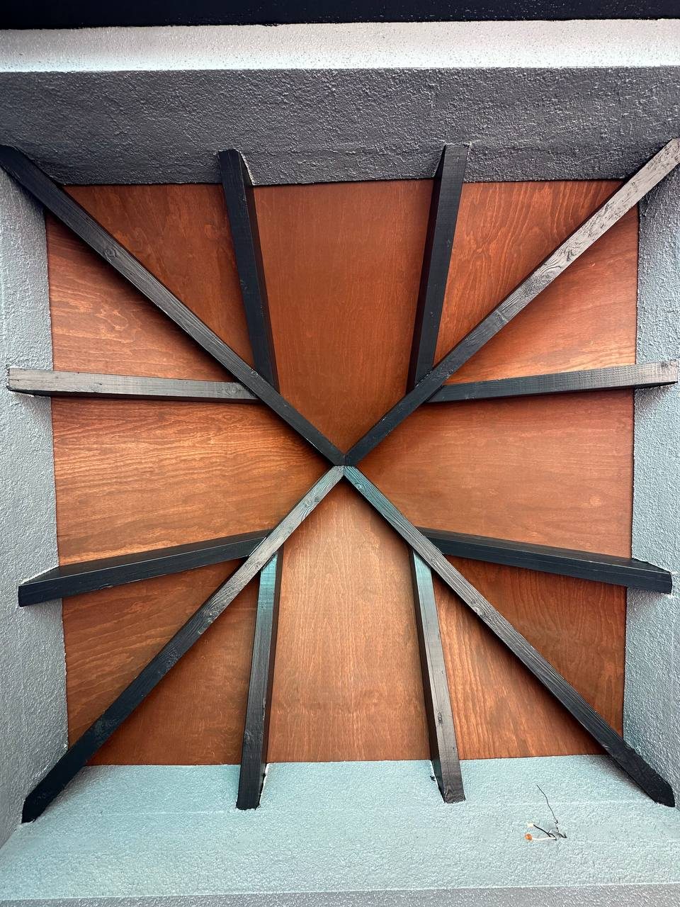 Decorative metal sunburst feature panel