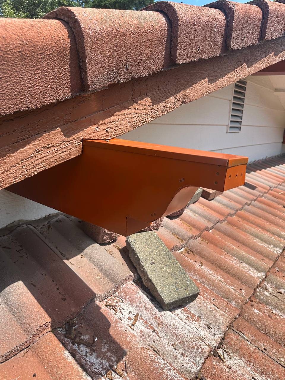 Custom metal edge and flashing on a tile roof